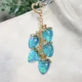 Beautiful blue translucent resin strawberry keychain with golden heart clasp charm - Transparent Blue
