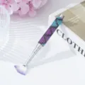 Close-up of rhinestone-studded handle and purple fan-shaped nail art brush detail. - Mermaid Skirt