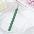 Close-up of green rhinestone nail art tool for spider gel pulling and lining - Green