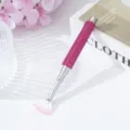 Detail view of pink rhinestone-encrusted fan nail art brush with gradient bristles - Rose Red