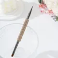 Close-up of double-ended nail art brush with sparkling champagne rhinestone handle - Champagne Gold