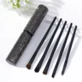 Detail view of 5-piece makeup brush set with sparkling rhinestone storage tube - Black