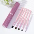 Detailed view of pink rhinestone makeup brush set with five soft brushes and case - Pink