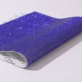 Close-up of sparkling purple self-adhesive rhinestone mesh for DIY decorations - Sapphire Blue