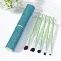 Detail of mint green makeup brush set with a sparkling blue rhinestone travel case - Lake Blue