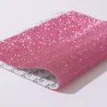 Close-up detail of pink self-adhesive rhinestone sticker sheet with glitter texture - Light Pink