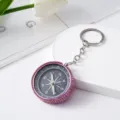 Pink rhinestone studded compass keychain for outdoor navigation and fashion accessory - Pink