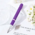 Detail view of purple rhinestone nail art pen with 5 interchangeable metal tips. - Deep purple