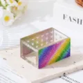 Close-up of rainbow rhinestone edge on 18-hole clear acrylic nail drill bit storage box - Colorful