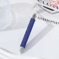 Detailed view of dual-ended nail art dotting pen featuring a blue rhinestone barrel - Sapphire Blue