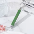 Macro view of green rhinestone dual-ended nail art dotting pen for precision gems - Green