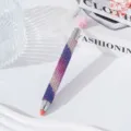 Detail view of a luxury rhinestone-studded dual-ended nail art dotting pen - Colorful Purple