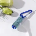 Close-up of a mini LED flashlight covered in sparkling blue rhinestones with a carabiner. - Sky Blue