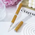 Close-up detail of a sparkling yellow rhinestone dual-ended nail art dotting pen tool - Yellow