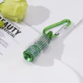 Detailed macro view of green mini LED flashlight with sparkling rhinestones and clip - Dark Green