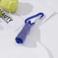 Close-up of blue mini LED flashlight keychain with rhinestone decoration and carabiner - Blue