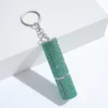 Macro view of a luxurious mint green rhinestone encrusted refillable perfume bottle keychain. - 10ml / Light Green