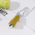 Close-up of mini emergency LED flashlight keychain covered in yellow rhinestones - Yellow