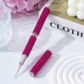 Close-up detail of dual-ended nail art dotting pen with sparkling pink rhinestone body - Rose Red