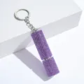 Close-up of a purple rhinestone-encrusted perfume atomizer keychain on white background - 10ml / Purple