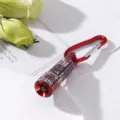 Close-up detail of a mini LED flashlight covered in sparkling rhinestones with red carabiner - Red Style 2