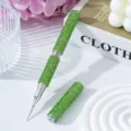 Close-up detail of luxury green rhinestone-encrusted dual-ended nail art dotting pen - Fluorescent Green