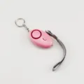 Loud personal safety alarm for women in pink with integrated LED light and lanyard - Pink