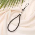 Close-up of 6mm sparkling diamond-encrusted mobile phone wrist strap in black - Dark Gray