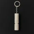 Close-up of shiny rhinestone-studded 5ml refillable perfume bottle atomizer keychain. - 10ml Capacity / AB White