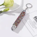 Detailed view of a mini LED flashlight keychain embellished with colorful rhinestones. - Without Battery / Multi-Color Diamonds