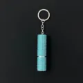 Close-up of a sparkling teal rhinestone-encrusted perfume atomizer keychain - Lake Blue