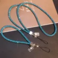 Close-up detail of luxury blue rhinestone phone lanyards with silver portrait charms. - Blue Set (Long + Short)