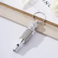Detailed view of silver rhinestone aluminum alloy whistle keychain for outdoor - AB White