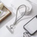 Fonkelende strass-telefoonband met zilveren metalen sluiting en grijze patch - Wit