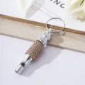 Close-up of rose gold rhinestone encrusted aluminum alloy survival whistle keychain - Khaki