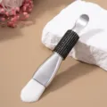 Close-up of a double-ended facial mask brush with soft bristles and a black rhinestone handle. - Soft Brush / Black