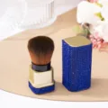 High-end makeup brush featuring sparkling blue rhinestones and soft brown bristles. - Royal Blue (Gold Base)