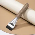 Detail shot of a professional flat-head foundation brush featuring champagne rhinestone handle - Khaki