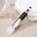 Detail view of dual-head silicone mask brush with rhinestone handle and metal scoop - Silicone Brush / Black