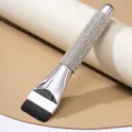 Detail view of luxury rhinestone flat foundation brush with shimmering silver handle design - White