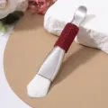 Close-up of double-ended facial mask brush with red rhinestone handle and soft white bristles - Soft Brush / Red
