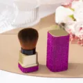 Close-up detail of luxury purple rhinestone-encrusted makeup brush for nail dust cleaning - Rose Red (Gold Base)