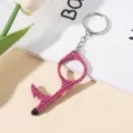 Close-up of pink rhinestone-studded no-touch door opener with stylus tip - Rose Red