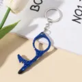 Detail of a blue rhinestone-encrusted portable door opener and stylus keychain - Sapphire Blue
