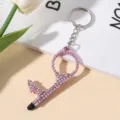 Close-up of pink door opener keychain with shimmering rhinestones - Pink