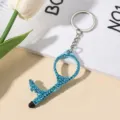 Detailed view of light blue rhinestone encrusted no-touch door opener keychain - Sky Blue