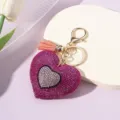 Sparkling heart keychain with pink rhinestones, silver inlay, and decorative tassel - Rose Red