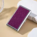 Close-up detail view of a premium silver metal cigarette case with sparkling magenta rhinestones - Rose Red