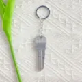 Portable silver mini key-shaped folding knife keychain for daily use and EDC detail - White