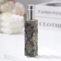 Close-up of a 10ml perfume spray bottle decorated with sparkling leopard print rhinestones. - 10ml / Yellow Python